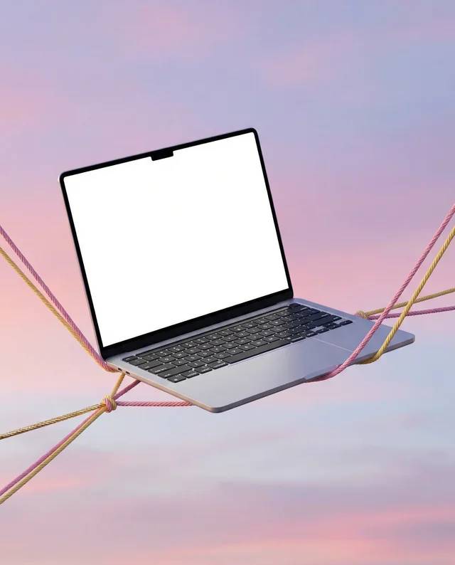 Sleek MacBook Mockup in Mid-Air with Colorful Ropes