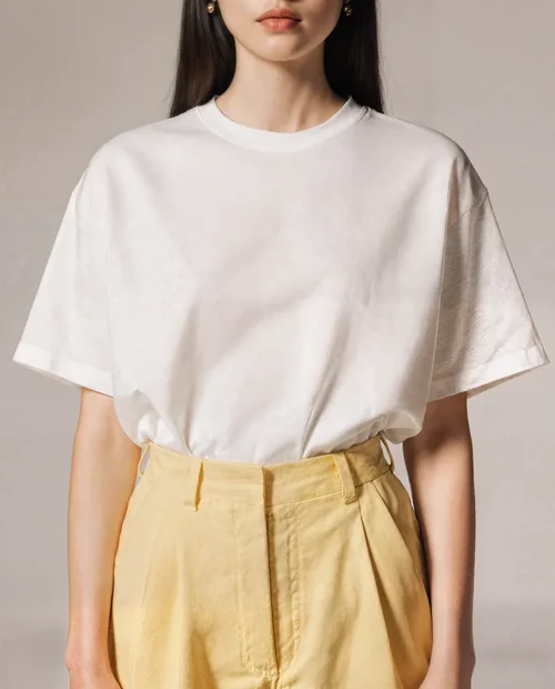 Stylish T-Shirt Mockup of a Young Woman