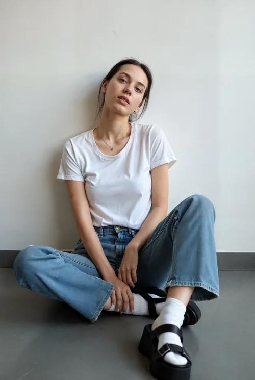 Mockup of T-Shirt with Soft Gray Background and Light Colors