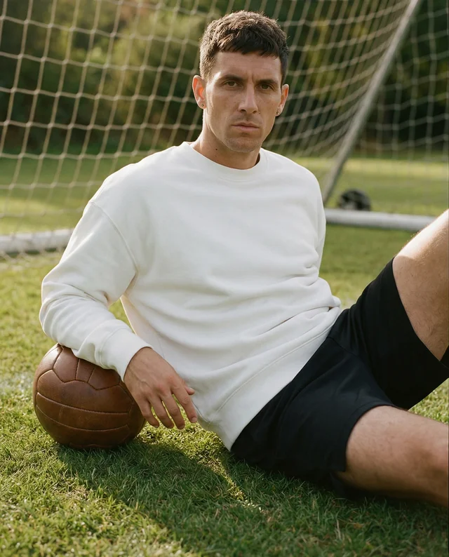 Athlete Mockup in Stylish Sweatshirt on Soccer Field