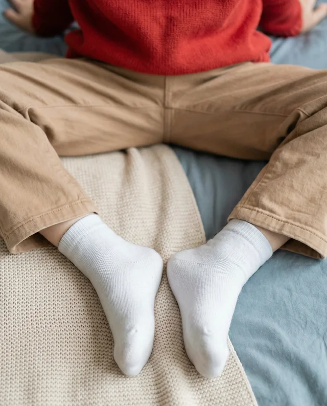 Cozy Socks Mockup on a Relaxed Bed Setting