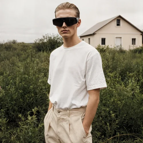 Mockup of T-Shirt Against Lush Green Background Colors