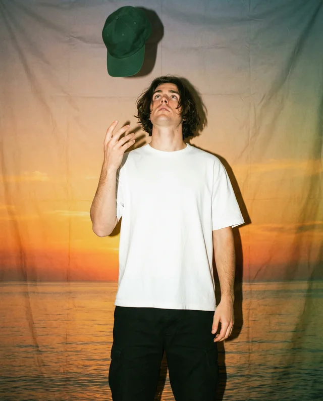 Stylish T-Shirt Mockup Against a Vibrant Sunset