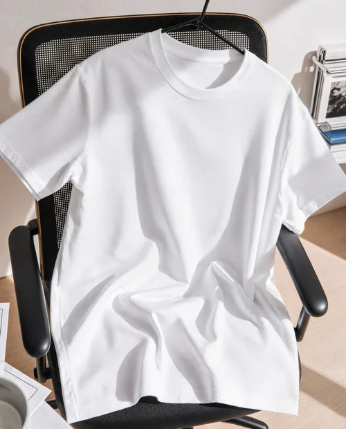 Stylish Mockup of a T-Shirt in a Modern Workspace