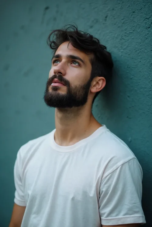 Contemplative Mockup of a T-Shirt on a Young Male Model