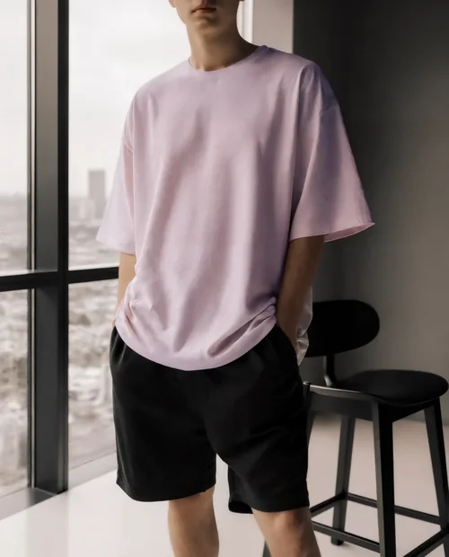 Stylish T-Shirt Mockup of a Young Man in Modern Setting