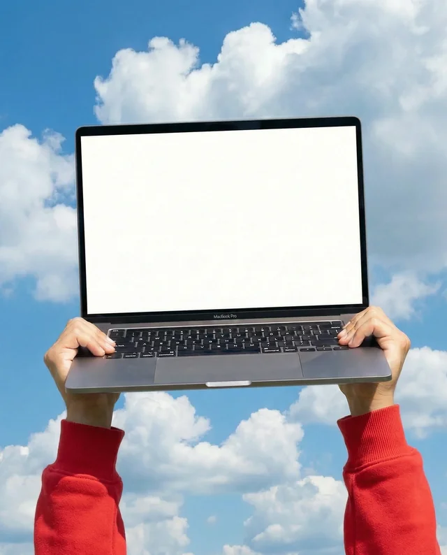 Sleek MacBook Mockup Against Vibrant Blue Sky