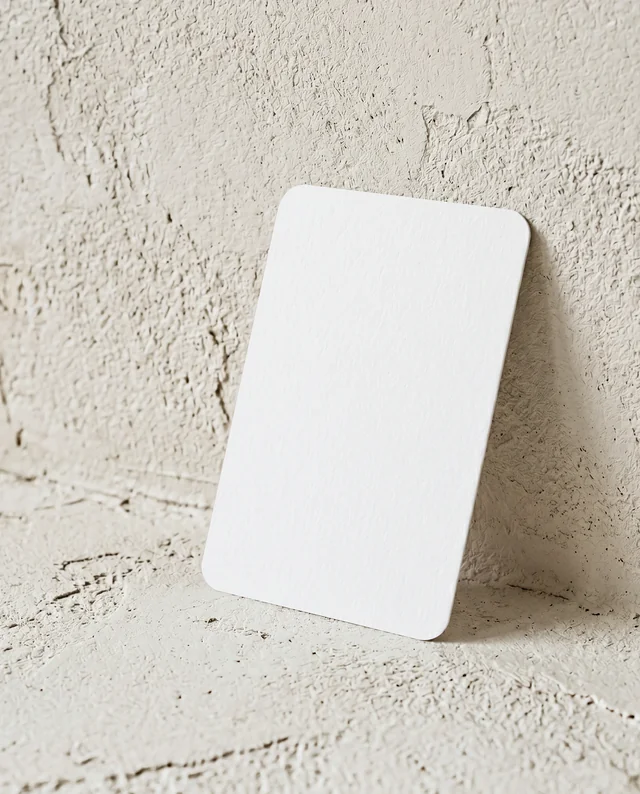 Elegant Business Card Mockup Against Textured Gray Wall