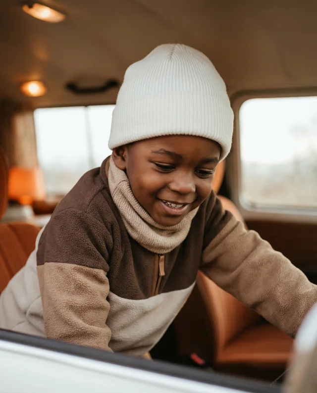 Joyful Boy in Vintage Vehicle Mockup with Cozy Beanie