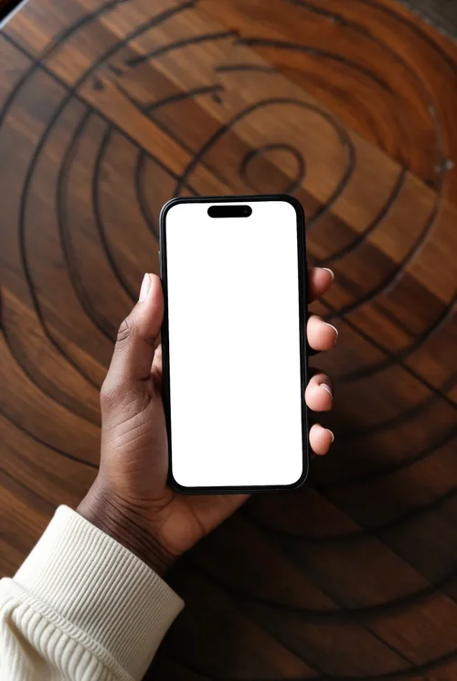 Mockup of iPhone 16 Pro Max on Wooden Table - Minimalist