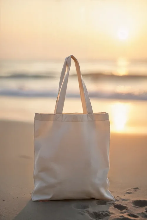 Elegant Tote Bag Mockup on a Serene Beach at Sunset