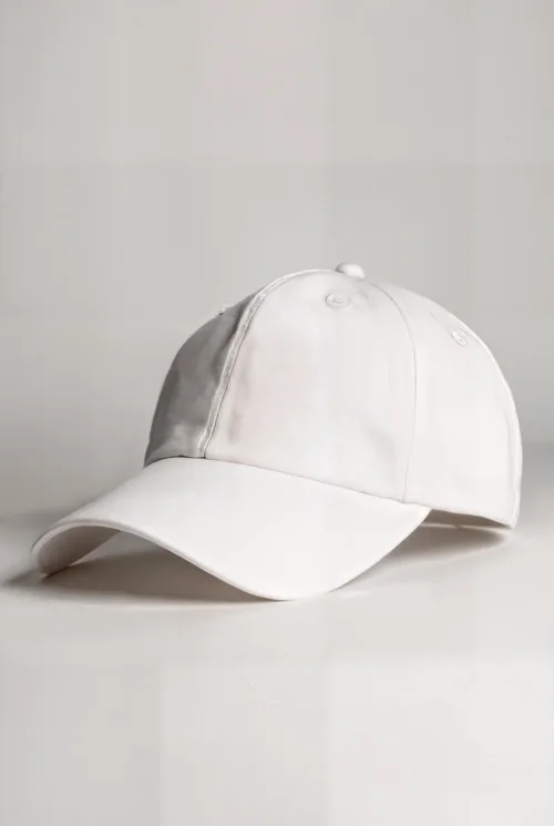 Stylish Mockup of a White Hat on a Light Surface