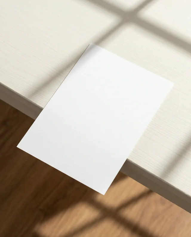 Elegant Mockup of a Blank Flyer on Wooden Table