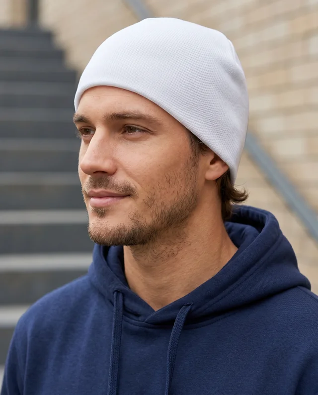 Stylish Beanie Mockup Featuring a Thoughtful Young Man