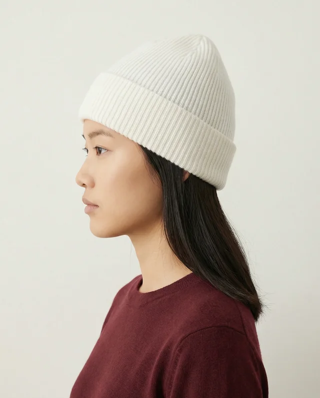 Serene Young Woman in Profile with Ribbed White Beanie Mockup