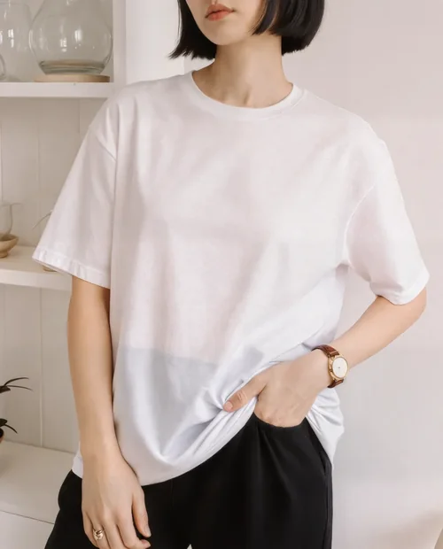 Stylish T-Shirt Mockup of Young Woman in Modern Interior