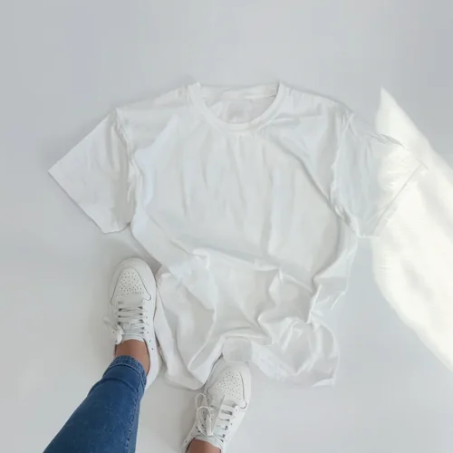 Mockup of White T-Shirt on Light Neutral Background