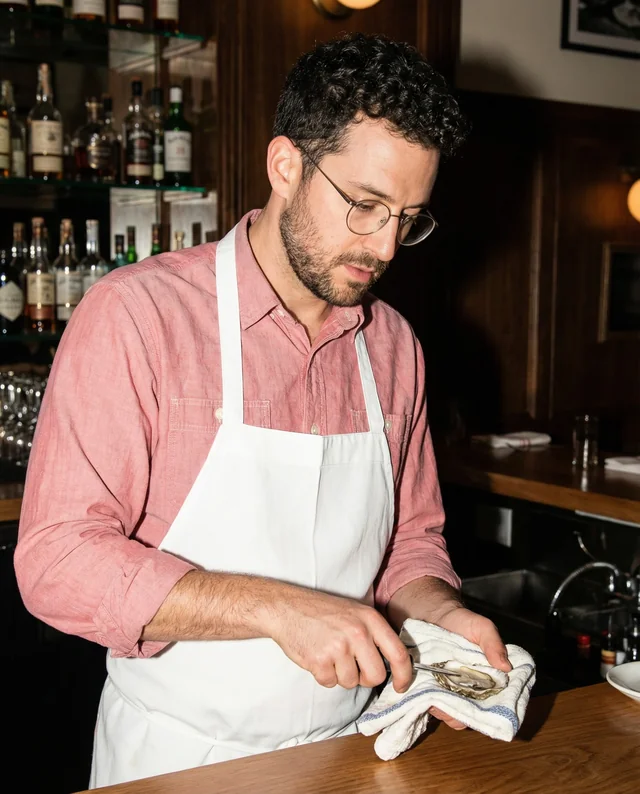 Bartender Mockup Skillfully Shucking Oysters in Bar