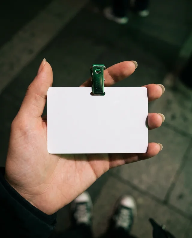 Close-Up Mockup of a Hand Holding a Blank ID Card
