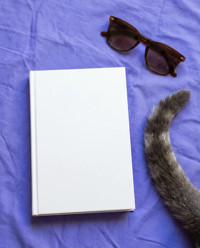 Stylish Mockup of a Book on Purple Fabric Background