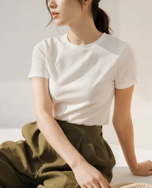 Stylish T-Shirt Mockup of a Young Woman in Natural Light