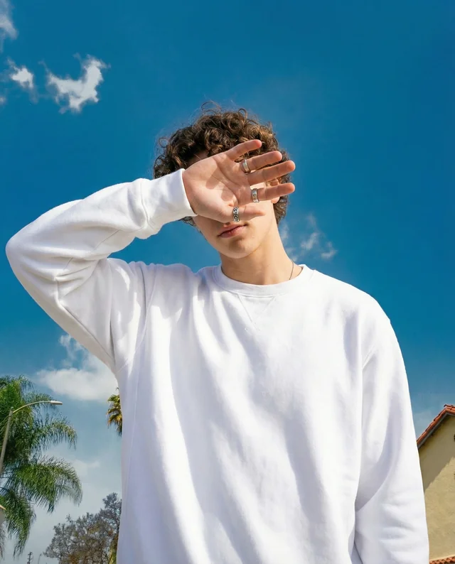 Stylish Mockup of a Young Man in a Sweatshirt Outdoors