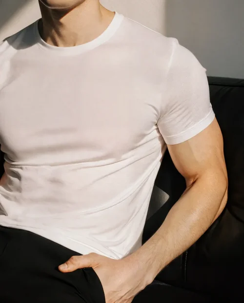 Stylish T-Shirt Mockup of a Young Male Model