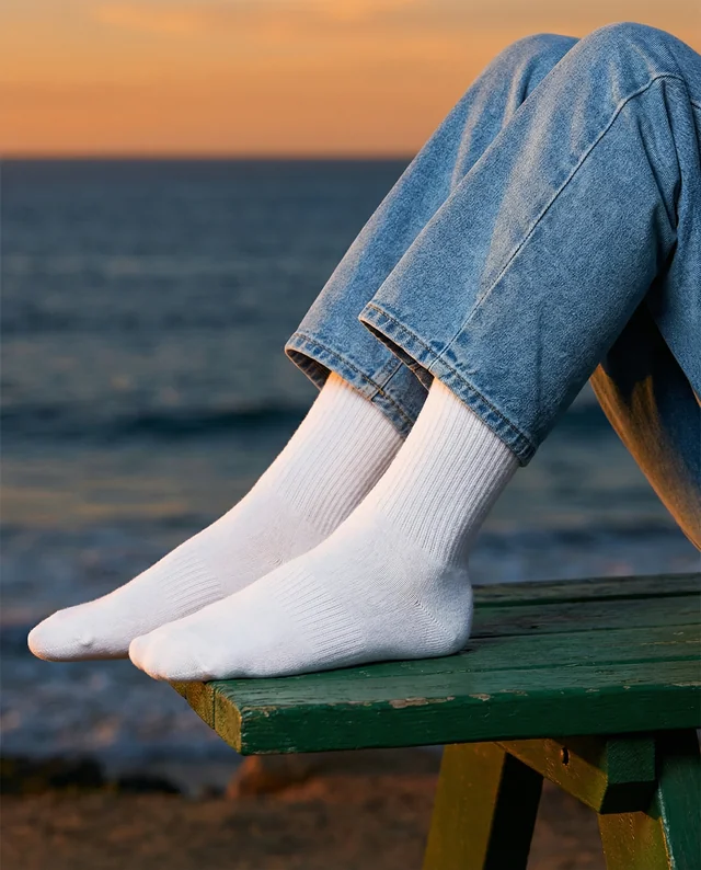 Relaxing Beach Mockup Featuring Feet in White Socks