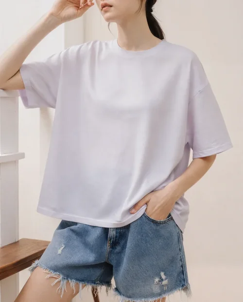 Stylish T-Shirt Mockup of a Young Woman in Casual Setting