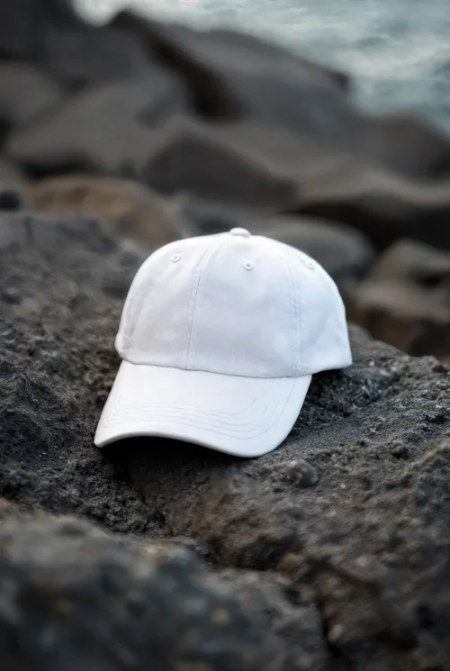 Stylish Mockup of a Hat on Rugged Rocky Surface
