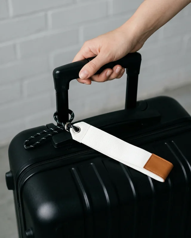 Chic Mockup of Lanyard and Black Hard-Shell Suitcase