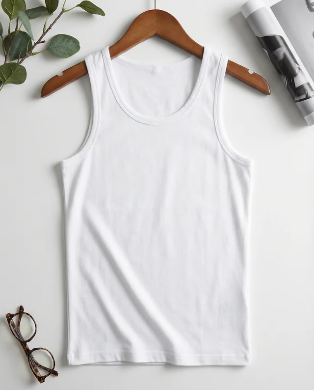 Minimalist Mockup of a White Tank Top with Accessories