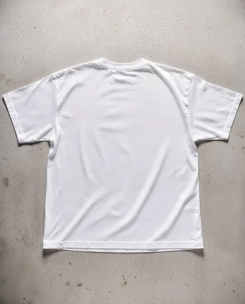 Mockup of Relaxed Fit White T-Shirt on Concrete Surface
