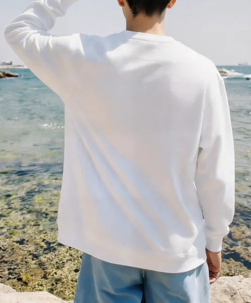 Tranquil Sweatshirt Mockup by the Coastal Landscape