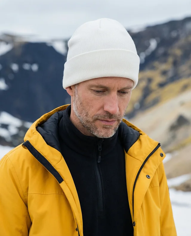 Contemplative Man in Beanie and Waterproof Jacket Mockup