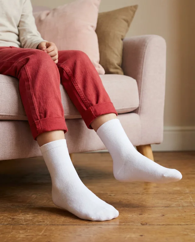 Cozy Indoor Mockup of Child Relaxing in Socks