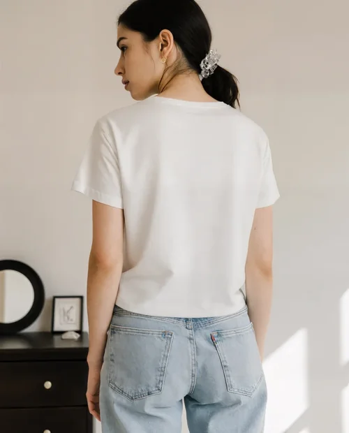 Stylish T-Shirt Mockup Featuring Young Woman