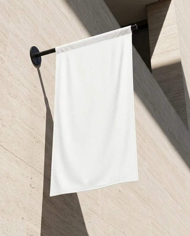 Elegant Mockup of a White Fabric Banner on Stone Wall