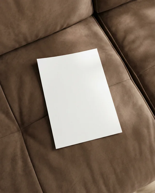 Elegant Mockup of a Flyer on a Cozy Couch Scene
