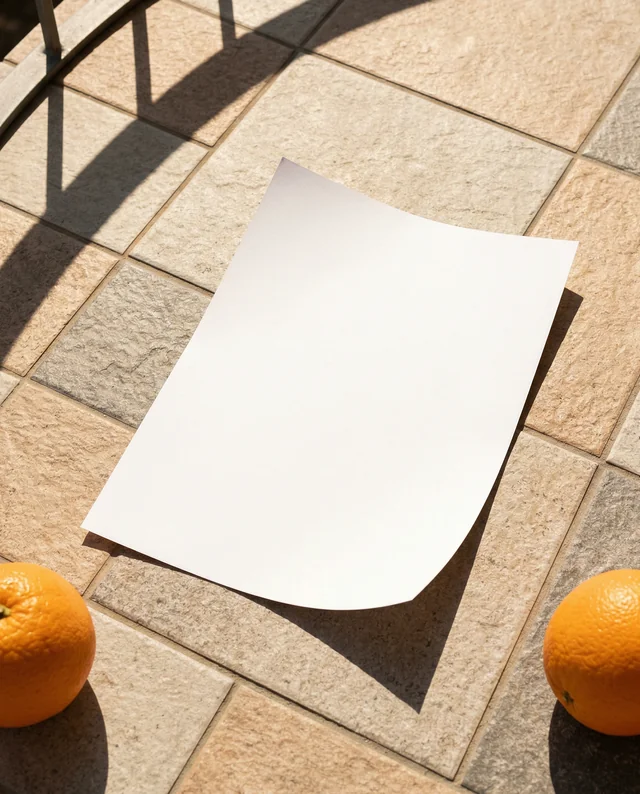Minimalist Mockup of a Flyer with Oranges on Stone Surface