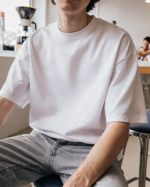 Casual T-Shirt Mockup in Modern Café Setting