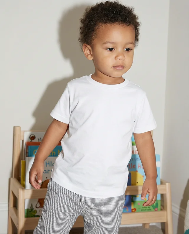 Mockup of a T-Shirt on a Confident Young Child