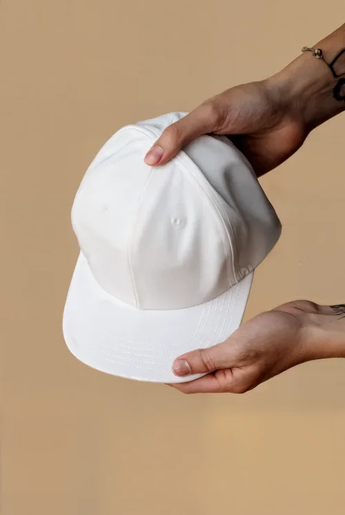 Stylish Mockup of a Hat in Hands with Soft Background