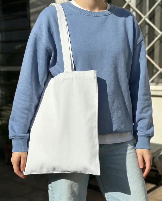 Stylish Mockup of a Casual Tote Bag in Sunlight