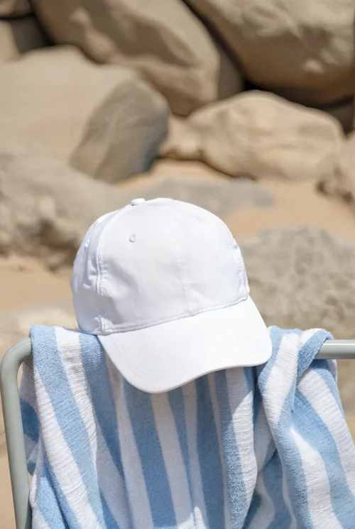 Stylish Mockup of a Hat on a Beach Towel
