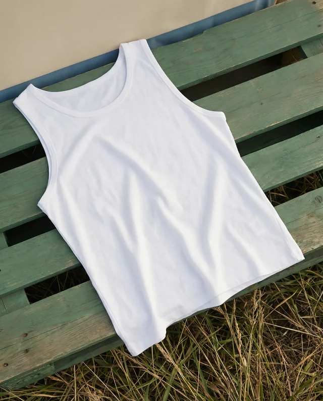 Elegant Mockup of a White Tank Top on Rustic Wood