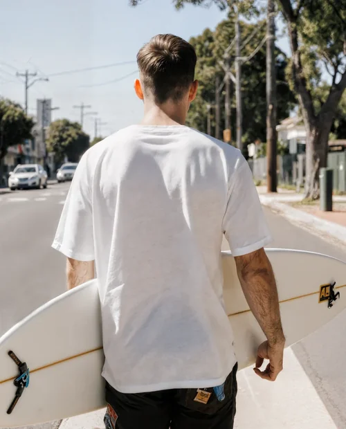 Mockup of Young Man in T-Shirt on Sunny Street