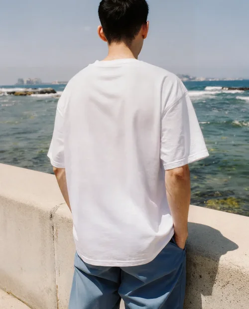 Summer Mockup of Young Man in T-Shirt by the Ocean