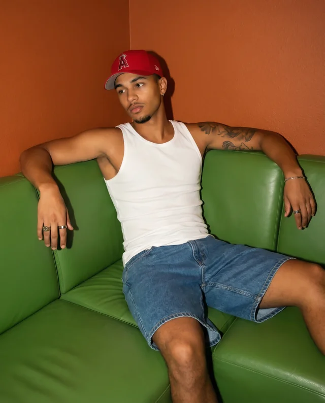 Casual Mockup of a Young Man in a Tank Top on Couch