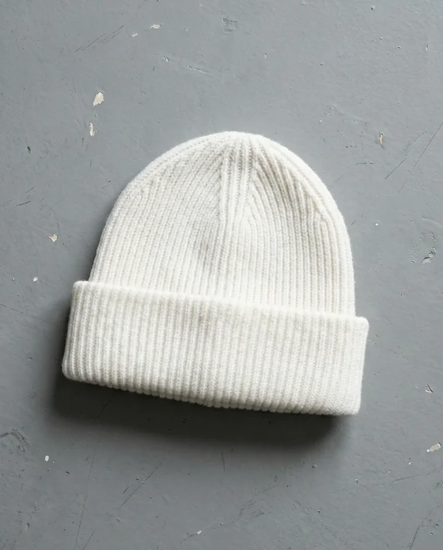 Cozy White Knitted Beanie Mockup on Gray Surface